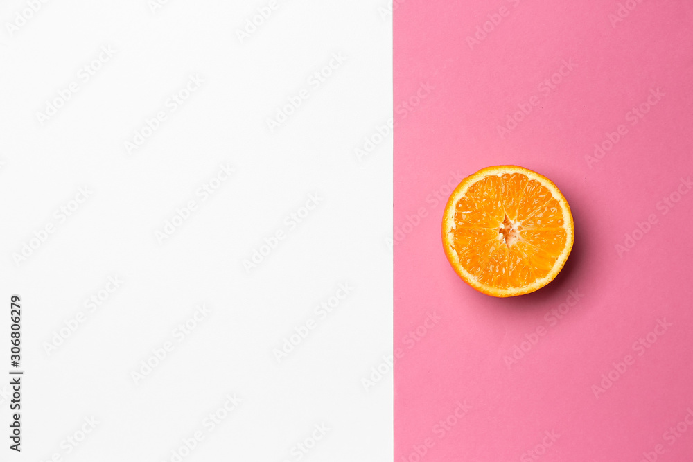 Ripe cut tangerine on color background