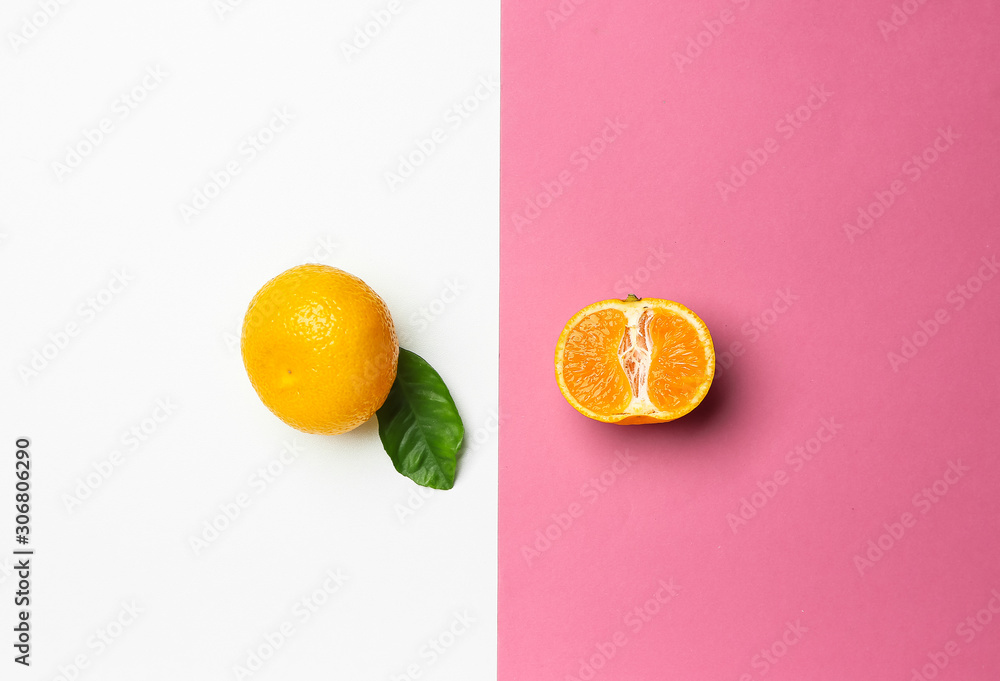 Ripe tasty tangerines on color background