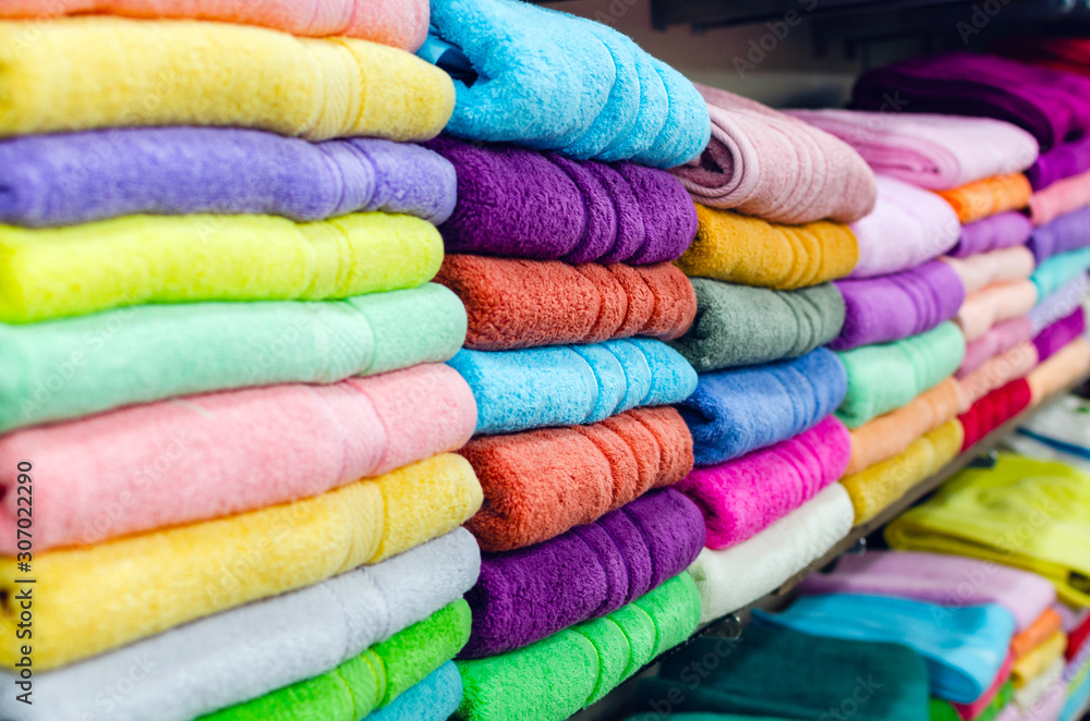 Colorful towels on the shelf in the store