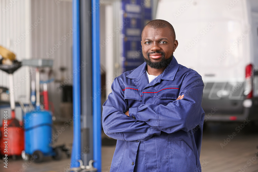 African-American mechanic in car service center