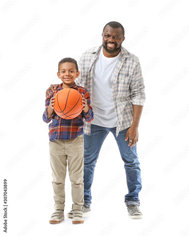 Portrait of African-American man and his little son with ball on white background