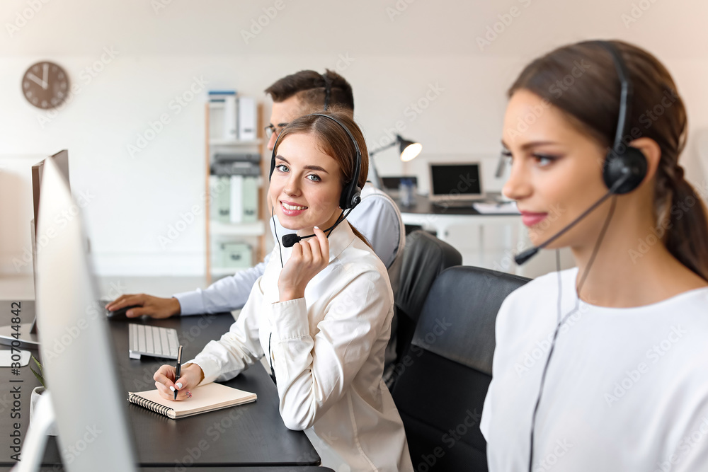 Team of technical support agents working in office