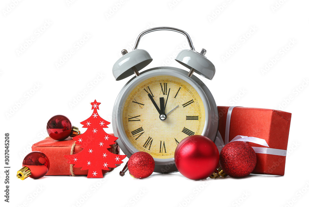 Alarm clock, decor and gifts on white background. Christmas countdown concept