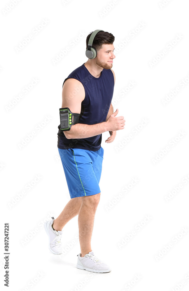 Sporty running young man on white background