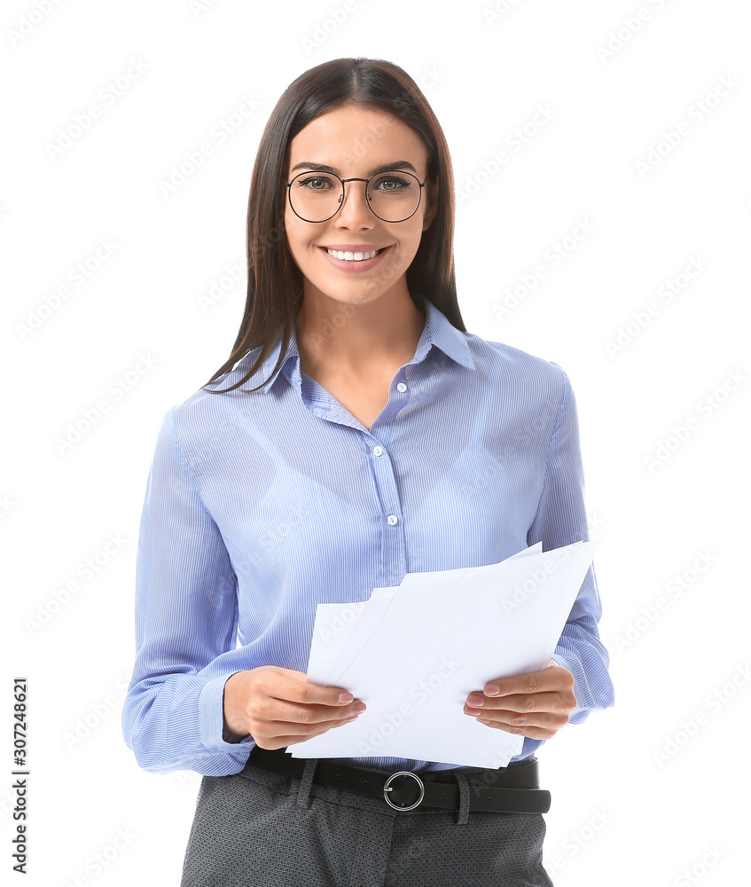 Beautiful young businesswoman with documents on white background