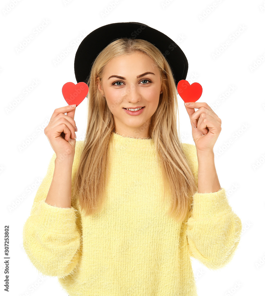 Beautiful young woman with small red hearts on white background