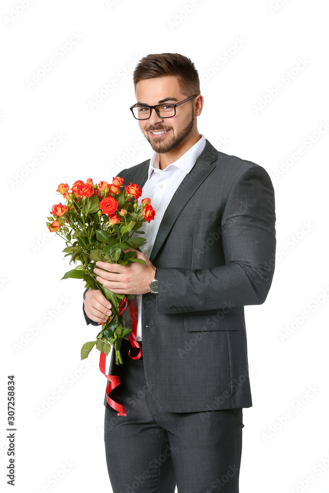 Handsome man with flowers on white background. Valentines Day celebration