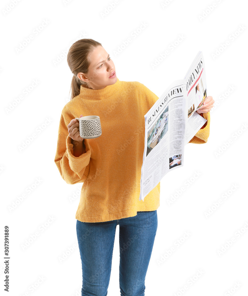 Young woman with newspaper and cup of coffee on white background