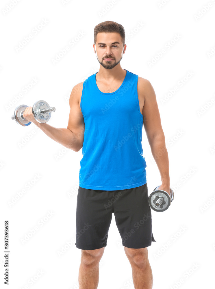 Sporty young man with dumbbells against white background