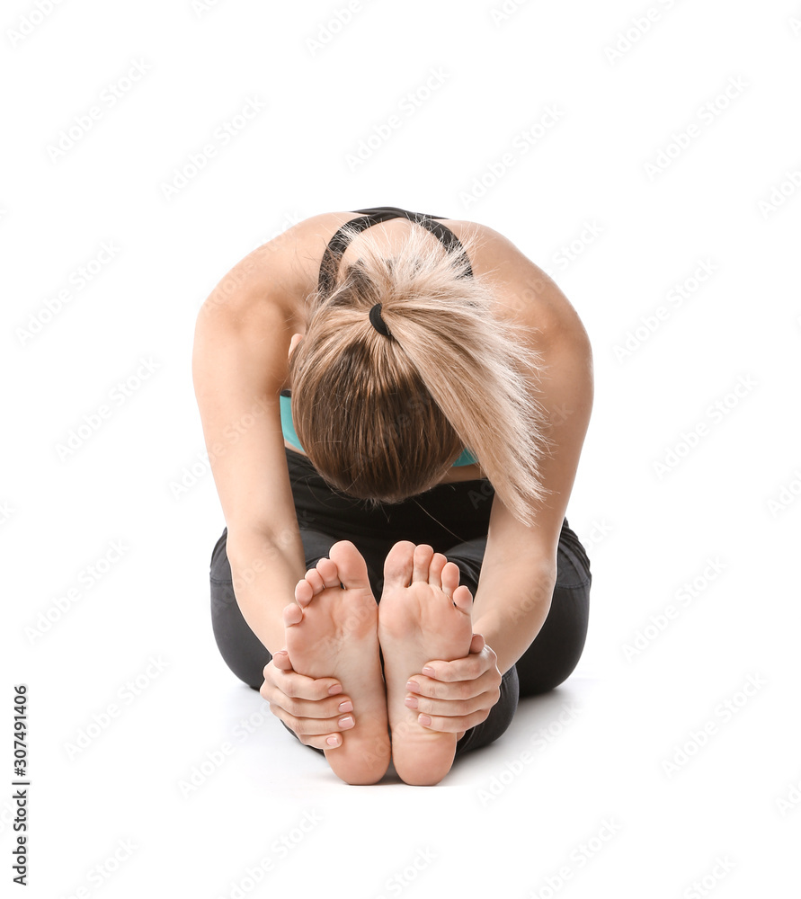 Beautiful young woman practicing yoga on white background