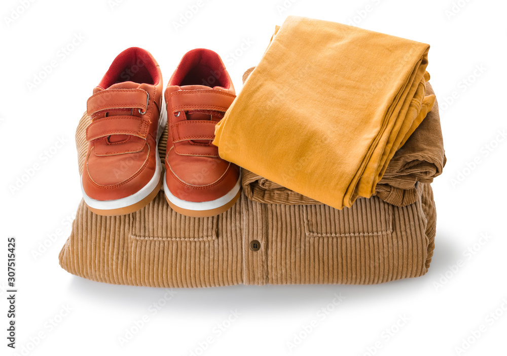 Clean kid clothes with shoes on white background