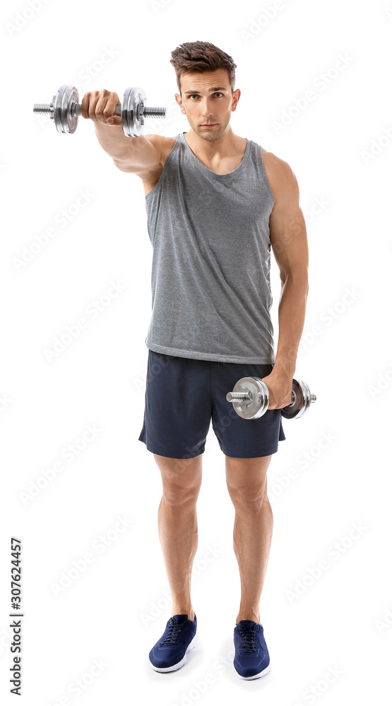 Sporty young man with dumbbells on white background