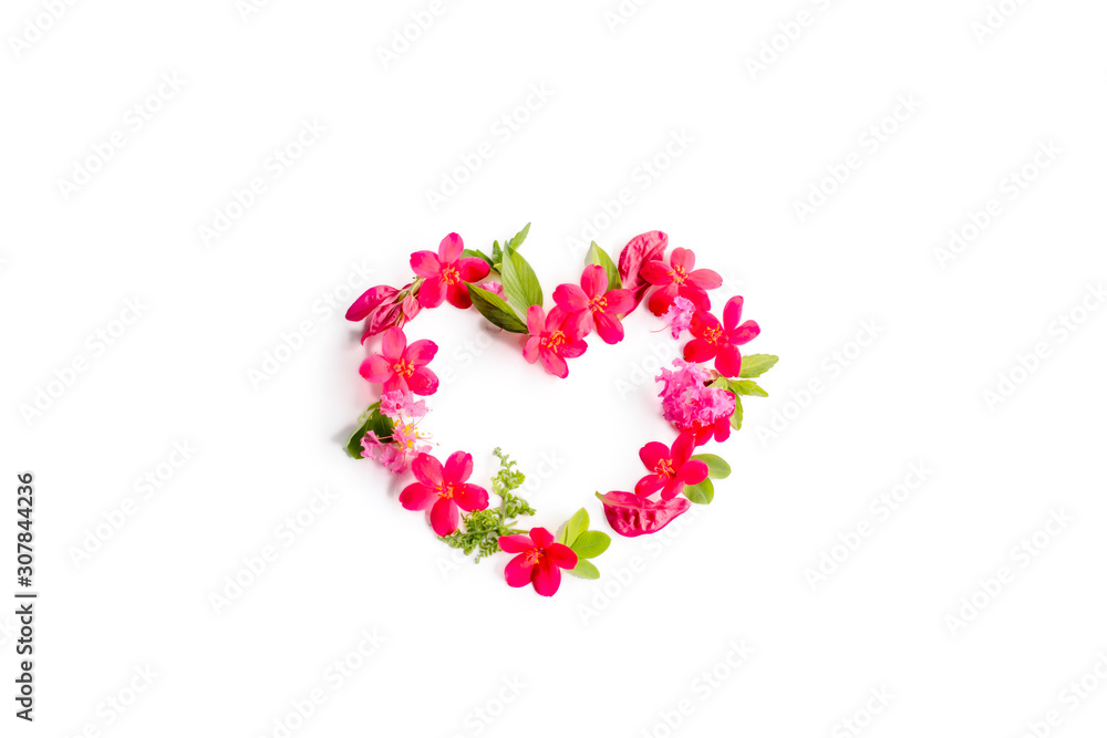 heart made of red pink flowers arrangement isolated on white