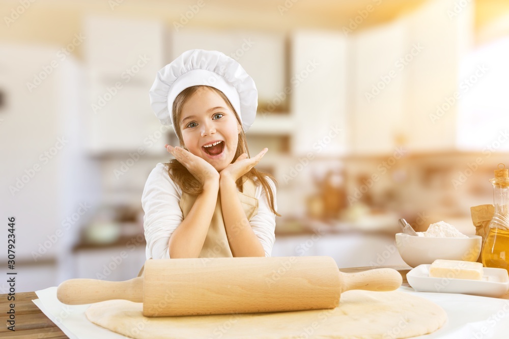 Portrait of adorable little girl preparing healthy food at kitchen