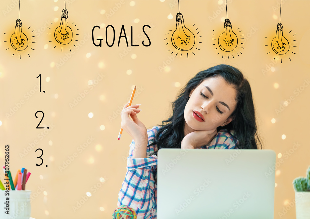 Goal list with young woman holding a pencil