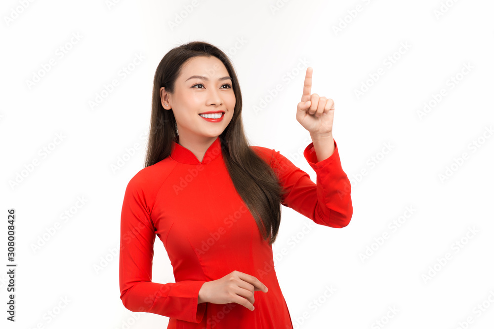 Vietnamese woman dress traditional ao dai at New Year and introducing