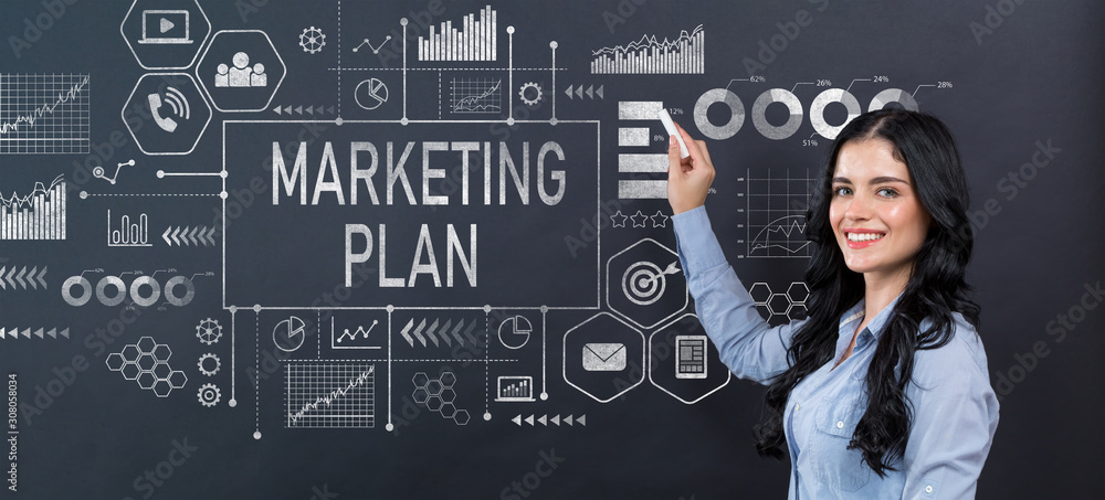 Marketing plan with young woman writing on a blackboard