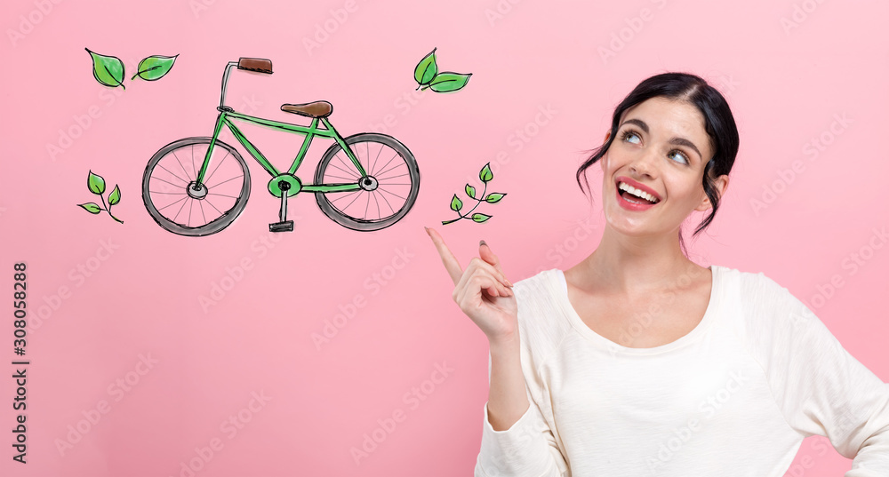 Eco bicycle with happy young woman pointing