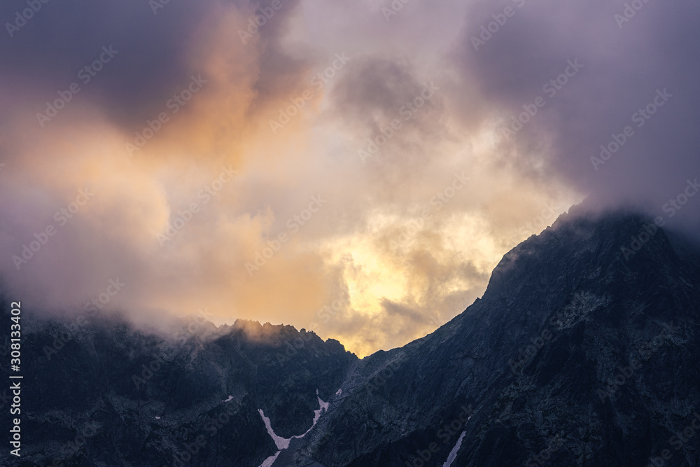 Dramatic sunset over a moutain alpine like landscape of High Tatras, Slovakia. Rugged rocky mountain