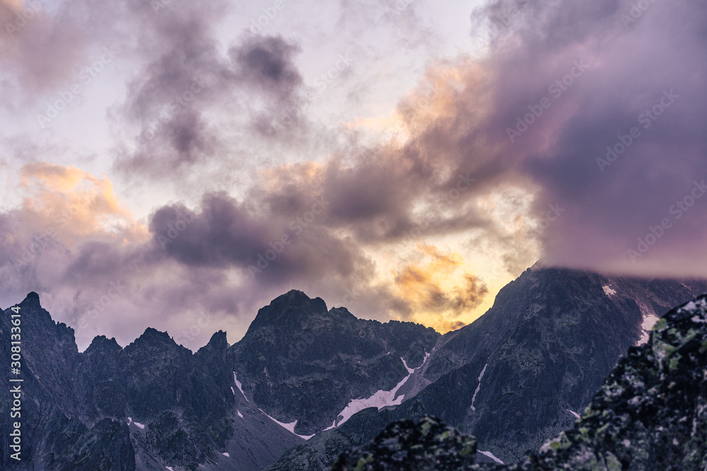 Dramatic sunset over a moutain alpine like landscape of High Tatras, Slovakia. Rugged rocky mountain