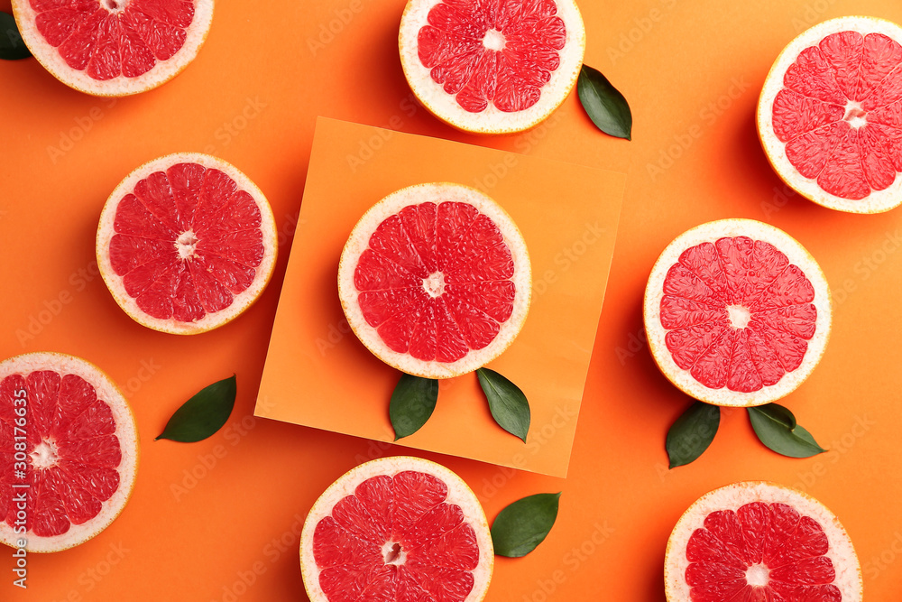 Fresh cut grapefruit on color background