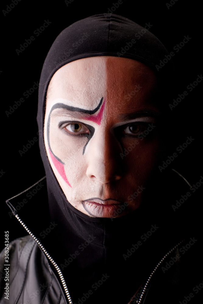 Actor face with make-up on black background