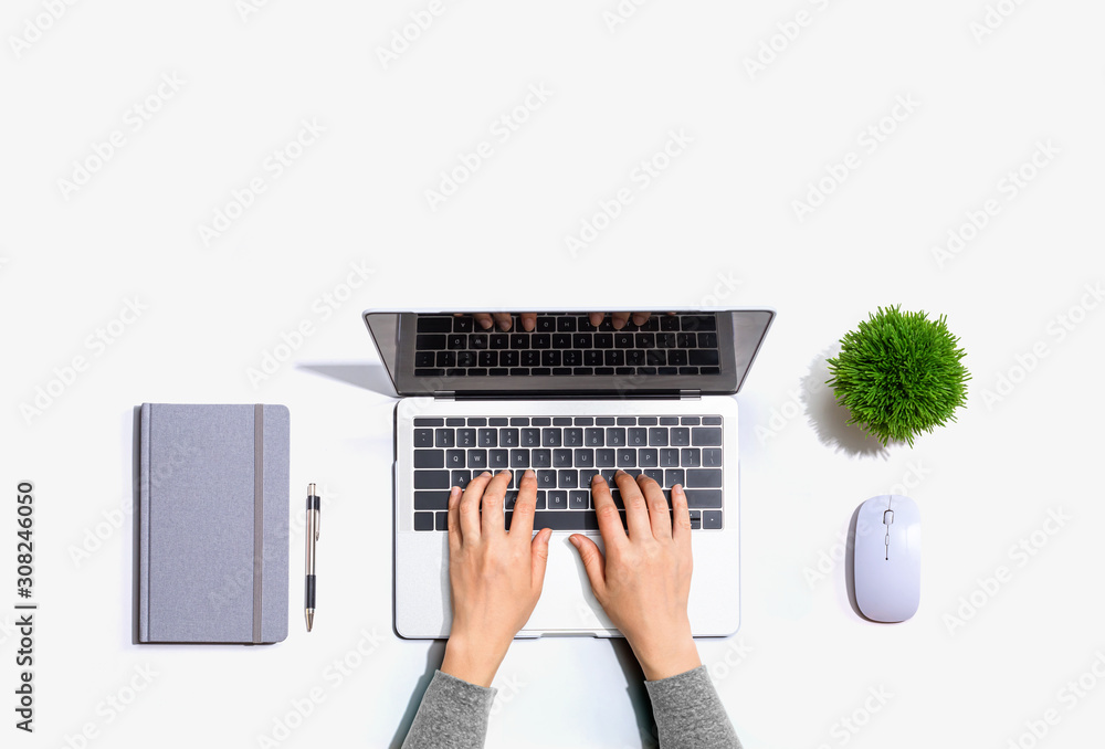 Person using a laptop computer from above