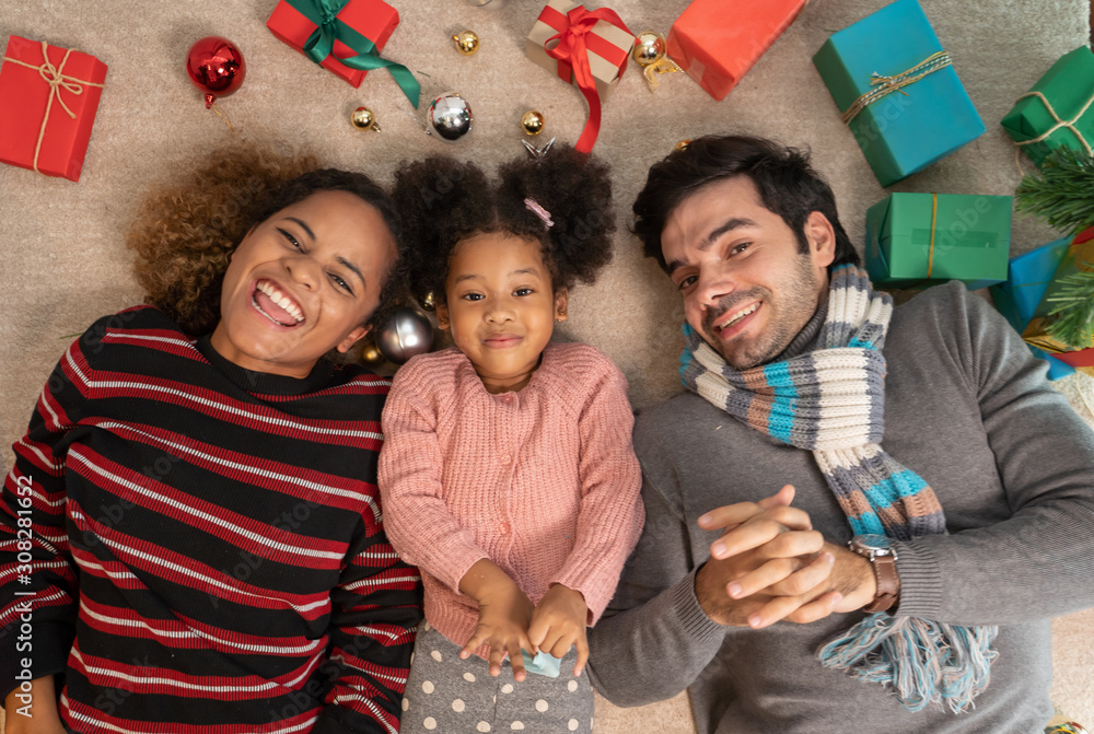 Portrait of Family exchange gifts on Christmas.