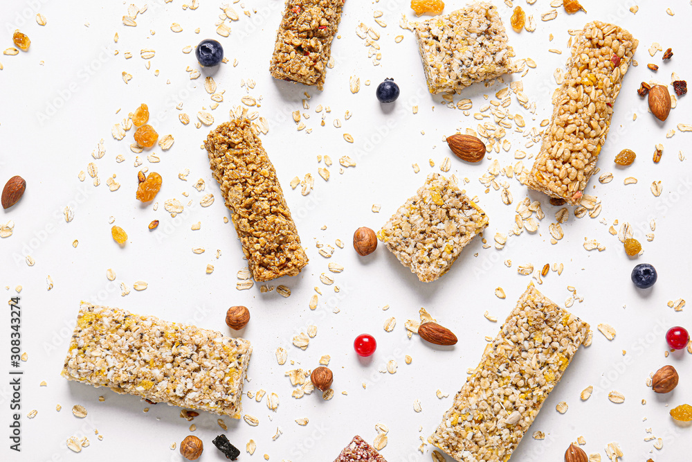 Different granola bars on white background