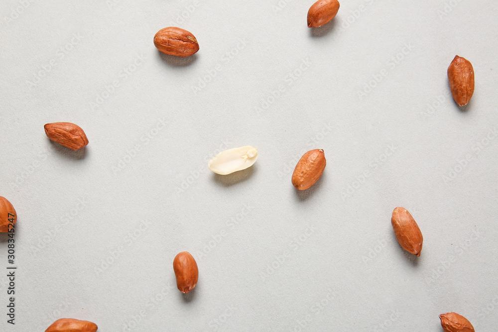 Tasty peanuts on light background