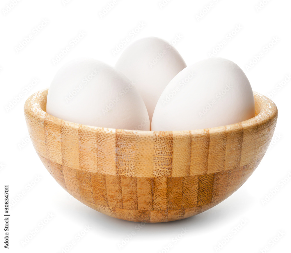 Bowl with fresh raw eggs on white background