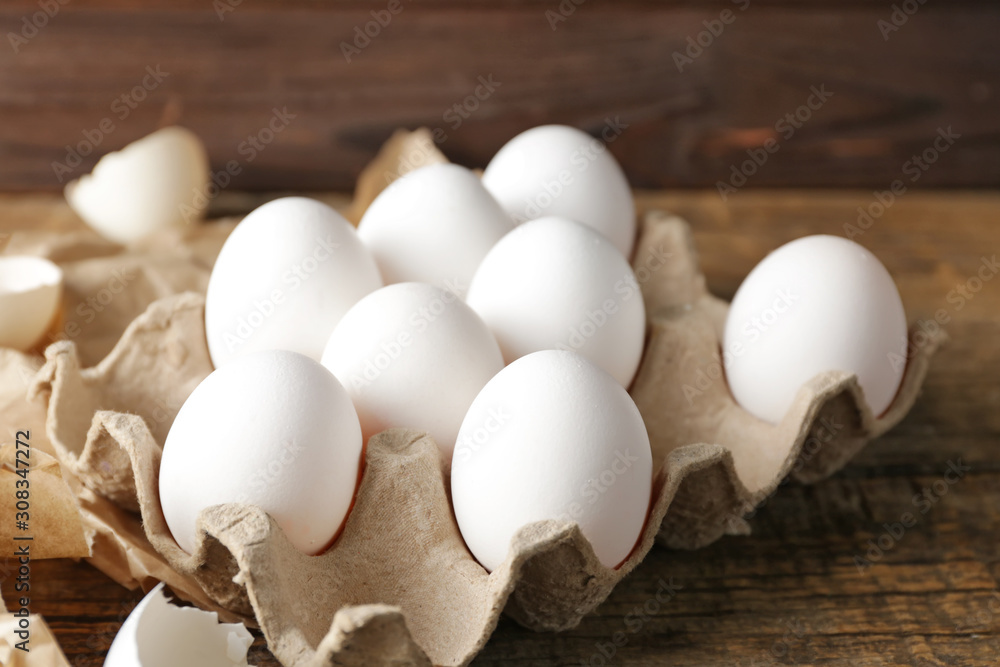 Fresh raw eggs on table