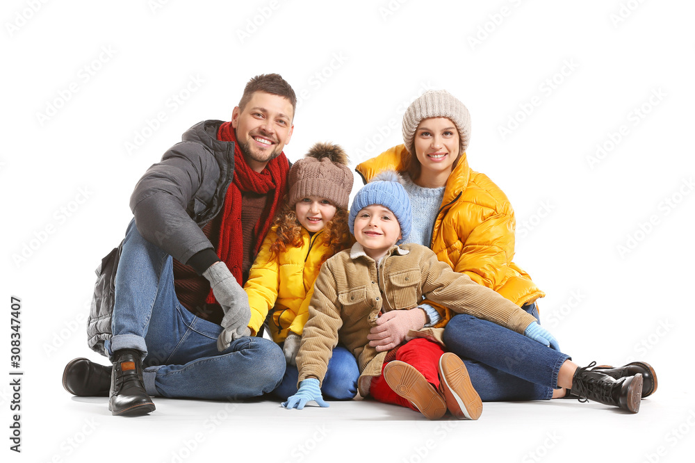 Happy family in winter clothes on white background