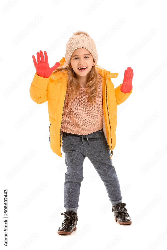 Cute little girl in winter clothes on white background