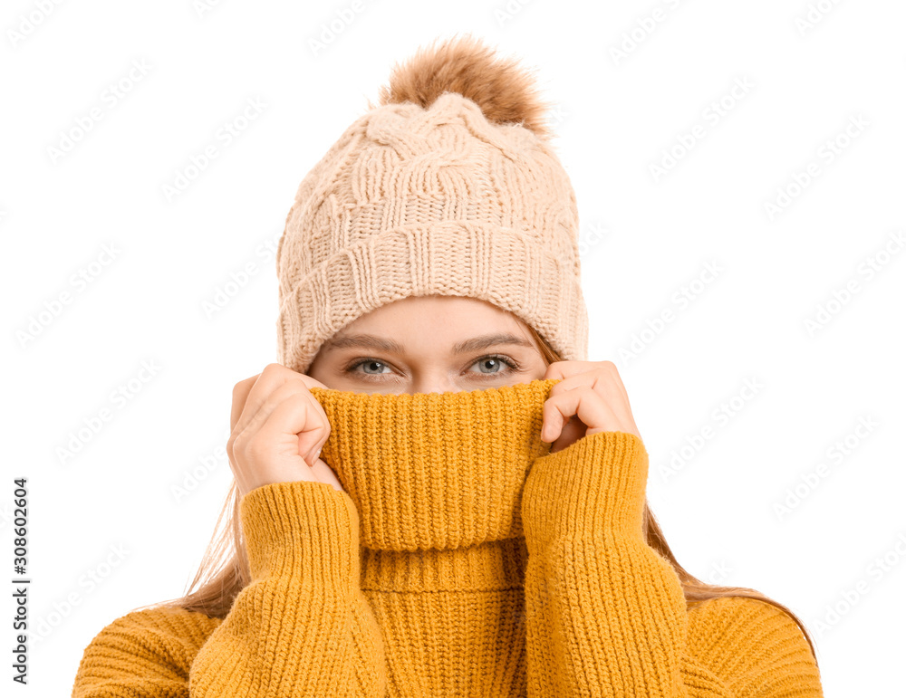 Beautiful woman in winter clothes on white background