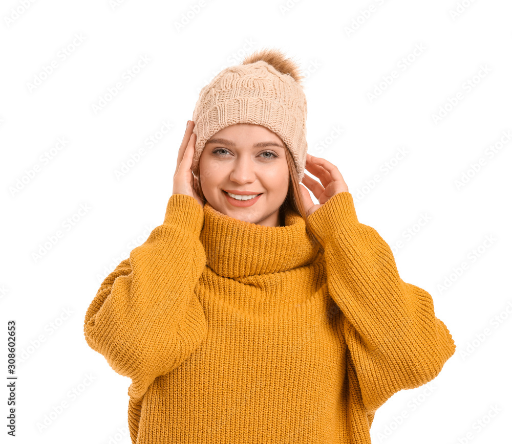 Beautiful woman in winter clothes on white background