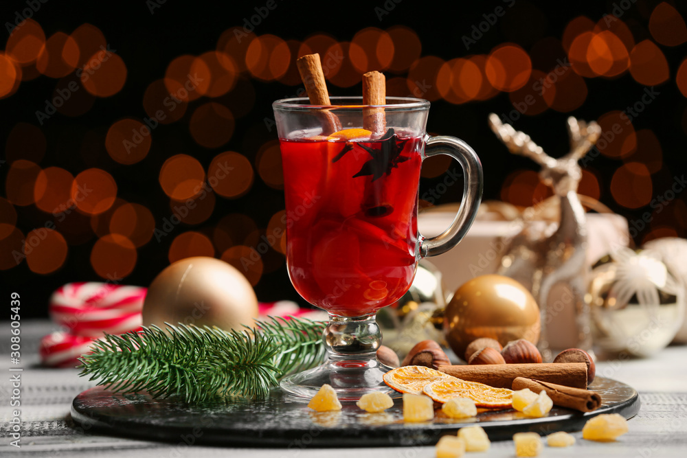 Glass cup of tasty mulled wine on table