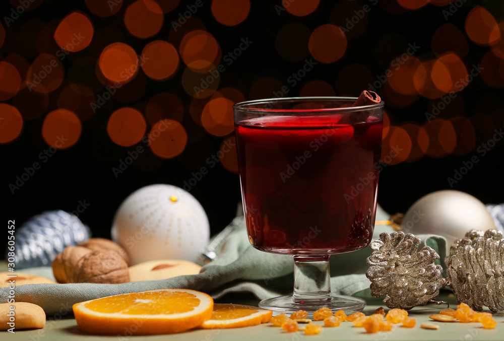 Glass of tasty mulled wine on table