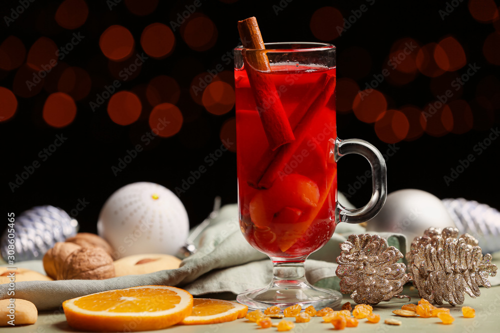 Glass cup of tasty mulled wine on table