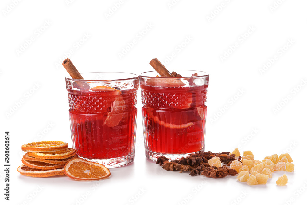 Glasses of tasty mulled wine on white background