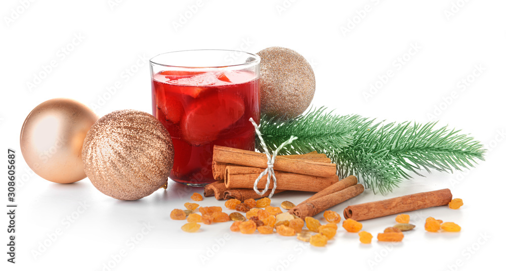 Glass of tasty mulled wine with Christmas decor on white background