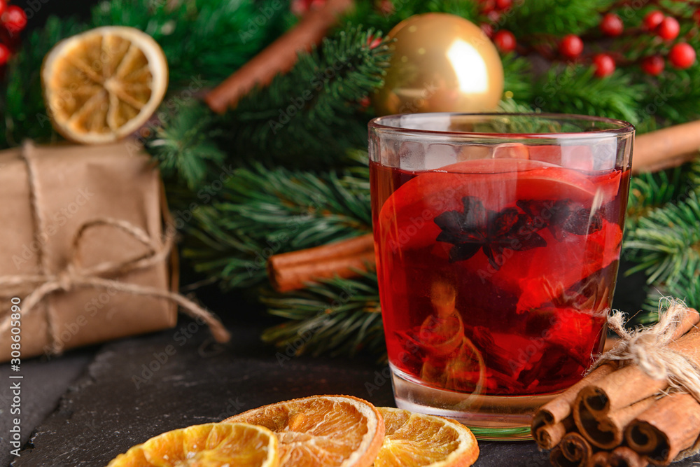 Christmas composition with tasty mulled wine on dark background