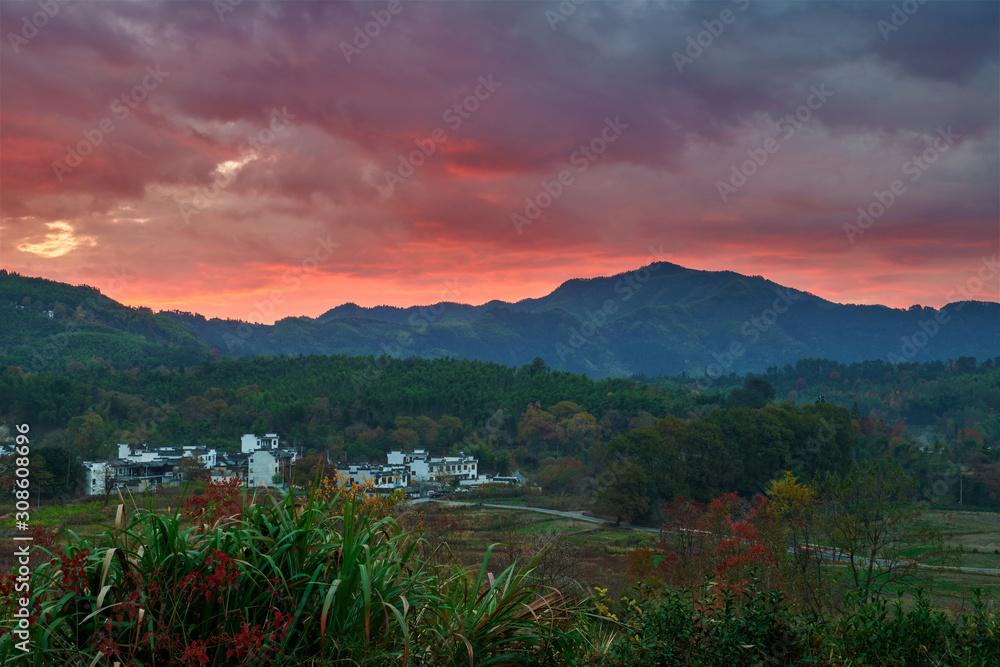 The beautiful cloudscape up the village and mountains sunrise.