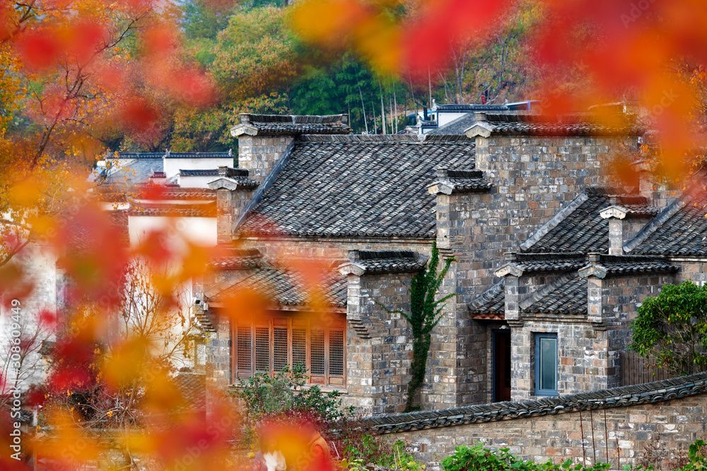 Hui-style architectures in fall forest on the hillside of China.