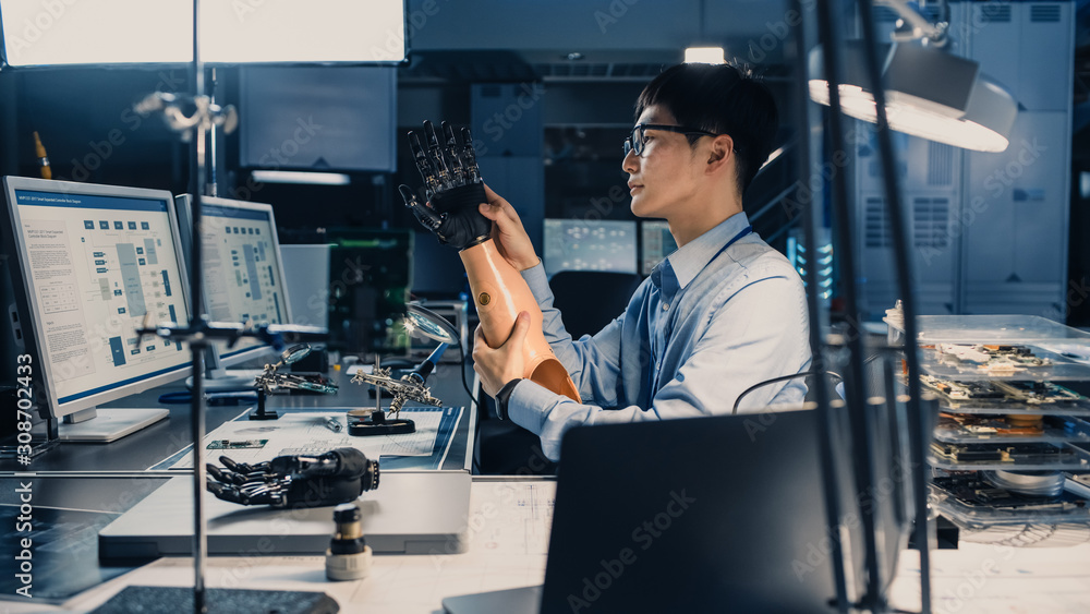 Futuristic Prosthetic Robot Arm Being Tested by a Professional Japanese Development Engineer in a Hi