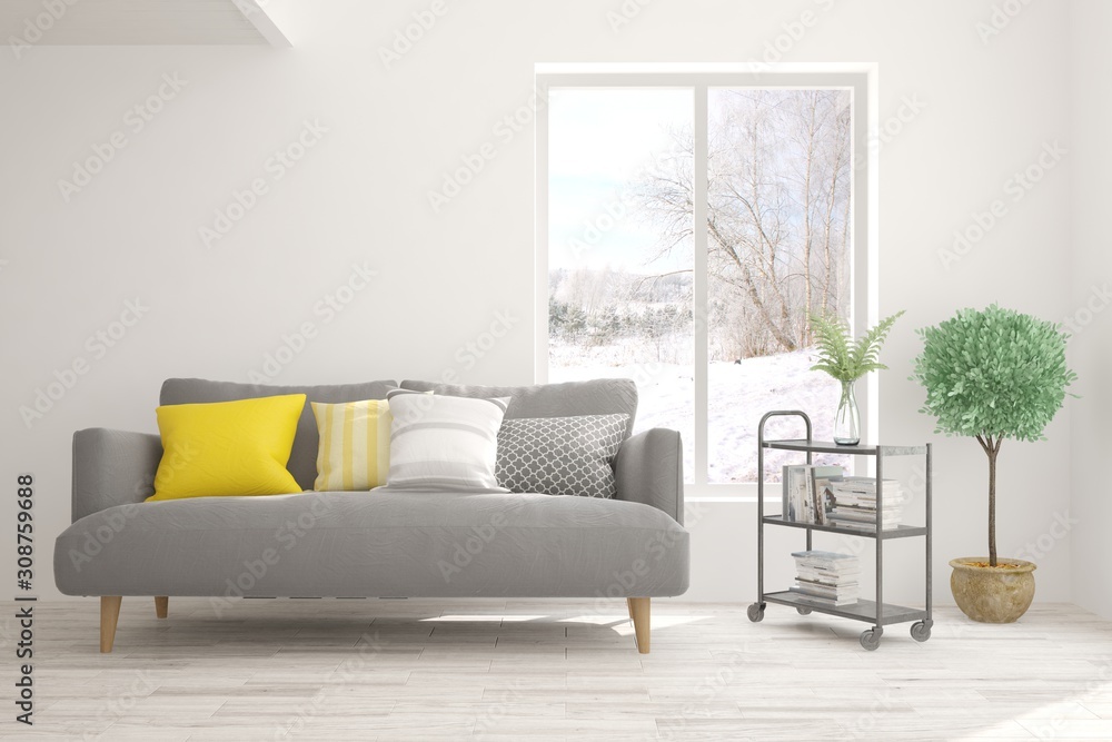 Stylish room in white color with sofa and winter landscape in window. Scandinavian interior design. 