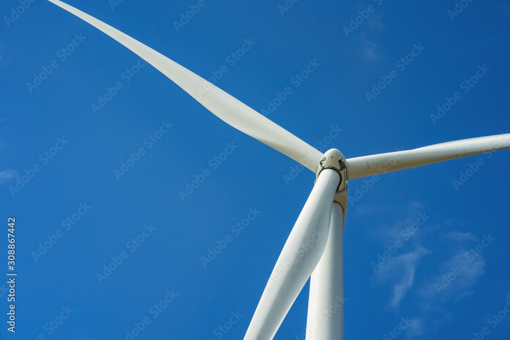 wind turbine and blue sky background. concept clean energy power in nature