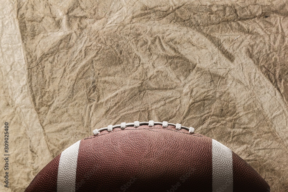 Classic american football ball on background