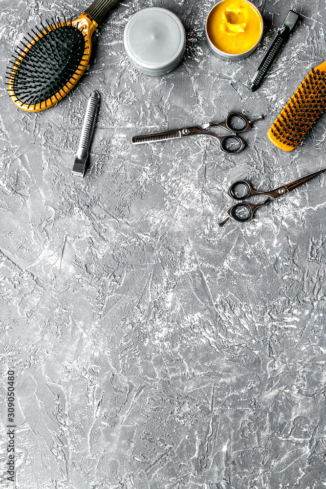 styling hair with tools in barbershop on gray background top view mock-up