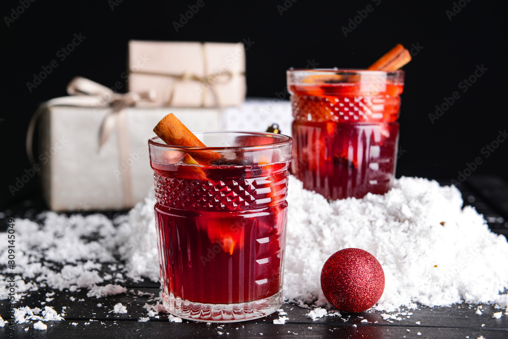 Christmas composition with tasty mulled wine on dark background